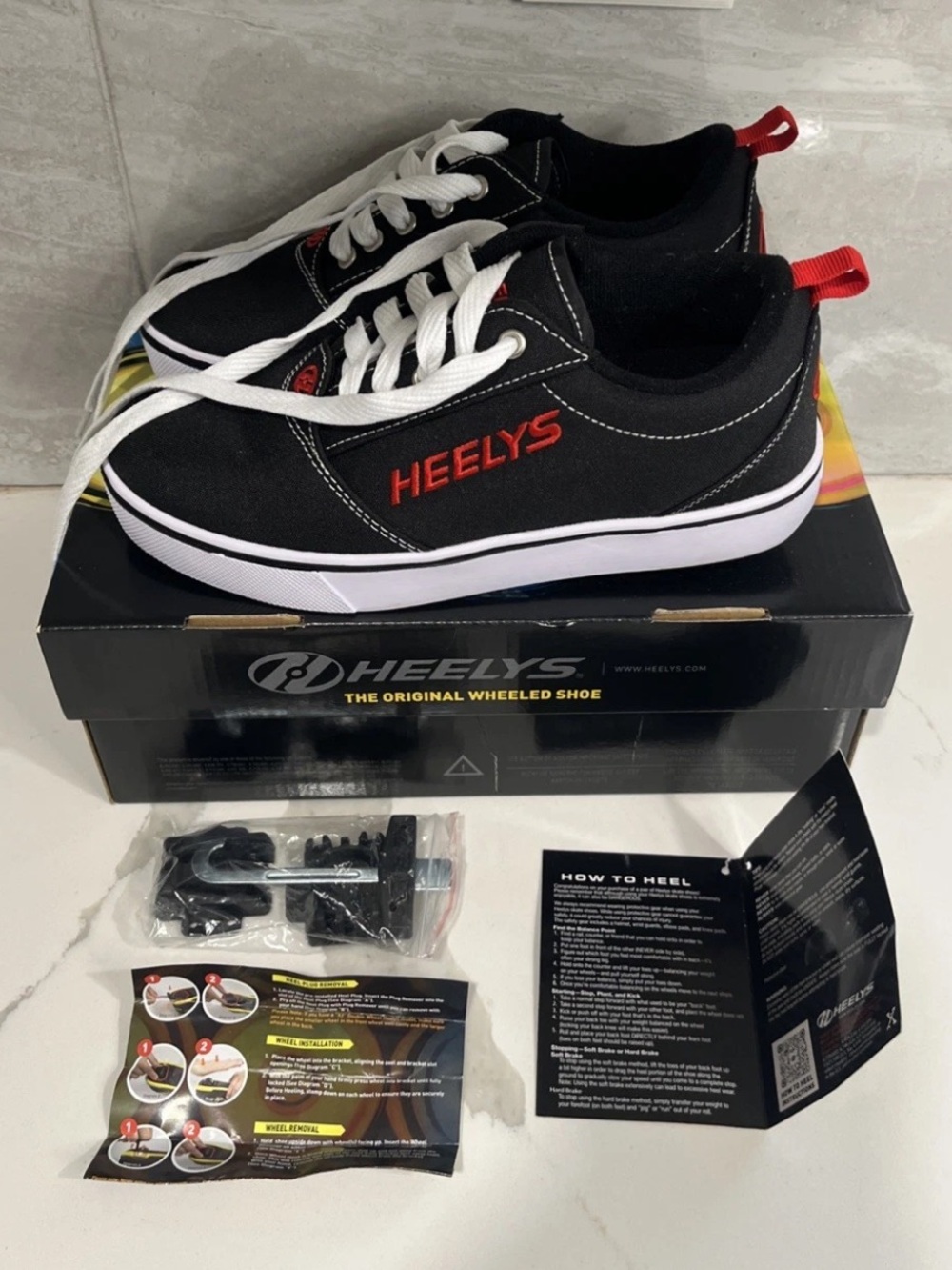 Heelys Black Canvas Sneakers with Red Accents and White Soles
